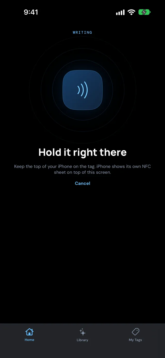 NFC Ninja on iPhone asking you to hold the phone near the tag to write it